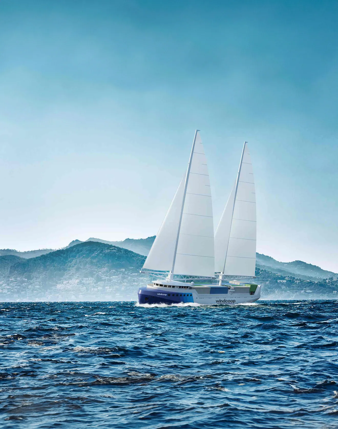 Le voilier-cargo Windcoop en mer devant un relief montagneux, vue d’artiste